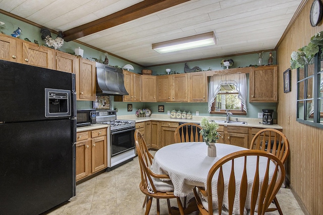 kitchen with black appliances, wall chimney range hood, a sink, light countertops, and crown molding