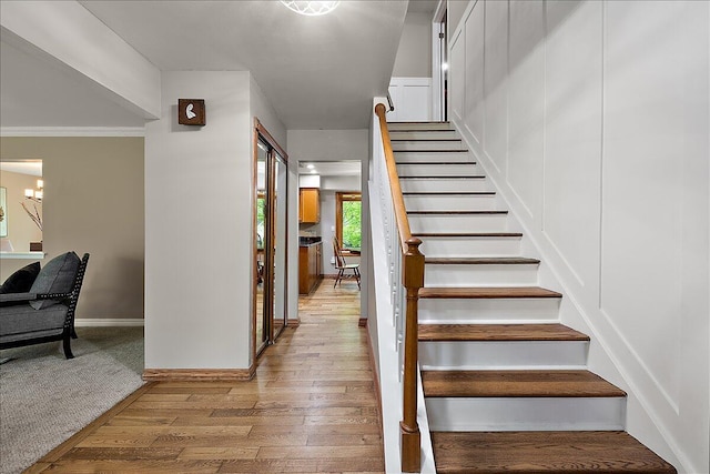 50951 Murray Hill Dr, Canton, MI 48187 - staircase featuring wood finished floors, baseboards, and crown molding