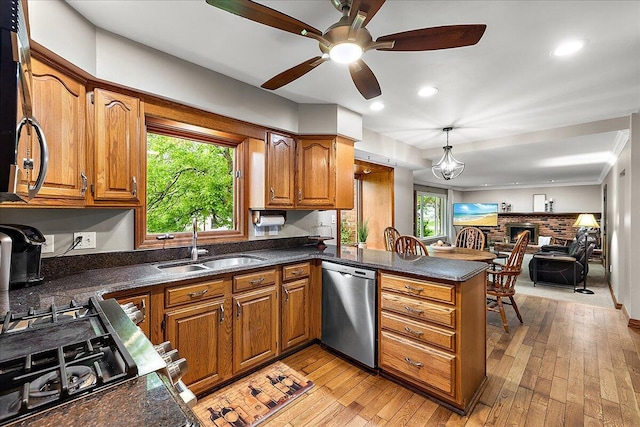 50951 Murray Hill Dr, Canton, MI 48187 - kitchen with dishwasher, a sink, a peninsula, brown cabinetry, and a ceiling fan