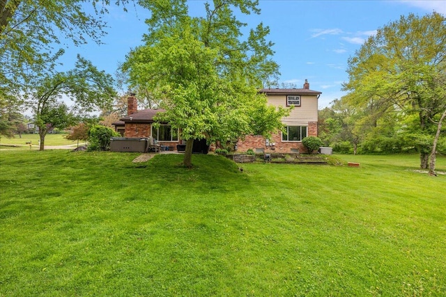 50951 Murray Hill Dr, Canton, MI 48187 - view of grassy yard featuring a hot tub