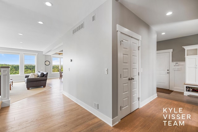 11650 Lally St NE, Lowell, MI 49331 - hallway featuring wood-type flooring, recessed lighting, and baseboards