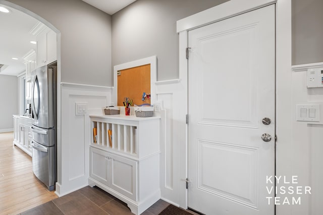 11650 Lally St NE, Lowell, MI 49331 - entryway with arched walkways, dark wood-style flooring, and recessed lighting