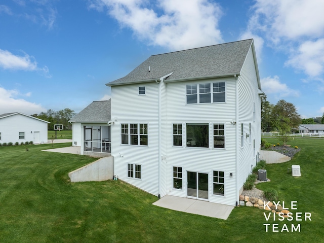 11650 Lally St NE, Lowell, MI 49331 - back of house with a patio, central AC unit, roof with shingles, and a sunroom