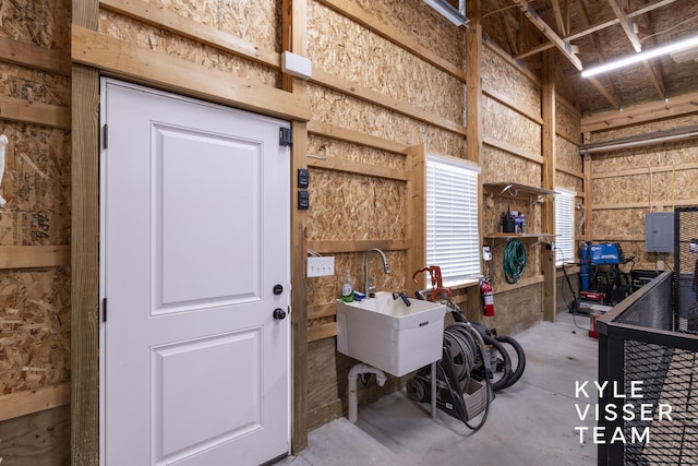 11650 Lally St NE, Lowell, MI 49331 - misc room with unfinished concrete flooring and a sink