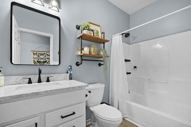 12700 Mcpherson St NE, Lowell, MI 49331 - bathroom with toilet, vanity, wood finished floors, shower / bath combo with shower curtain, and a textured ceiling