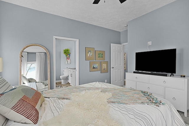 12700 Mcpherson St NE, Lowell, MI 49331 - bedroom with a textured ceiling, ceiling fan, and ensuite bath