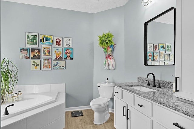 12700 Mcpherson St NE, Lowell, MI 49331 - full bath with wood finished floors, vanity, baseboards, toilet, and a bath