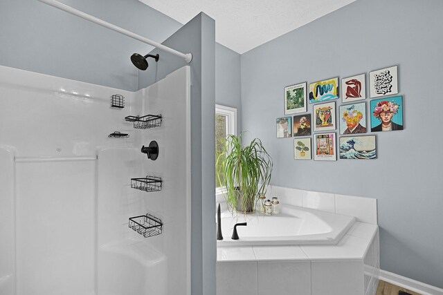 12700 Mcpherson St NE, Lowell, MI 49331 - full bath featuring a stall shower, a bath, and baseboards