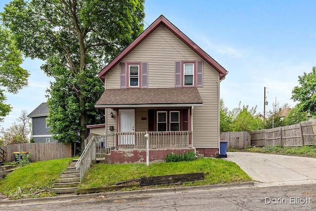 412 Breens Ct SW, Grand Rapids, MI 49503 - view of front of property with covered porch, fence, and roof with shingles
