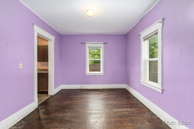 412 Breens Ct SW, Grand Rapids, MI 49503 - empty room featuring healthy amount of natural light, wood-type flooring, and baseboards