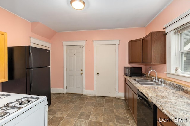 412 Breens Ct SW, Grand Rapids, MI 49503 - kitchen featuring black appliances, a sink, baseboards, and light countertops