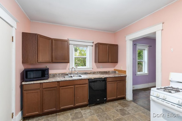 412 Breens Ct SW, Grand Rapids, MI 49503 - kitchen with black appliances, a sink, healthy amount of natural light, and baseboards