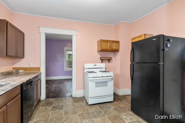 412 Breens Ct SW, Grand Rapids, MI 49503 - kitchen with black appliances and baseboards