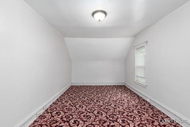 412 Breens Ct SW, Grand Rapids, MI 49503 - additional living space featuring lofted ceiling, carpet, and baseboards