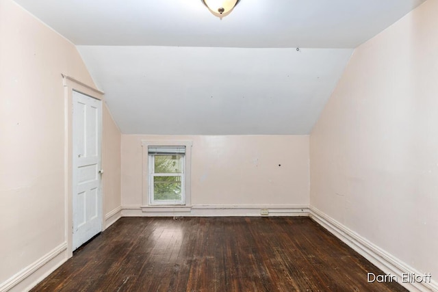 412 Breens Ct SW, Grand Rapids, MI 49503 - bonus room with vaulted ceiling, hardwood / wood-style floors, and baseboards
