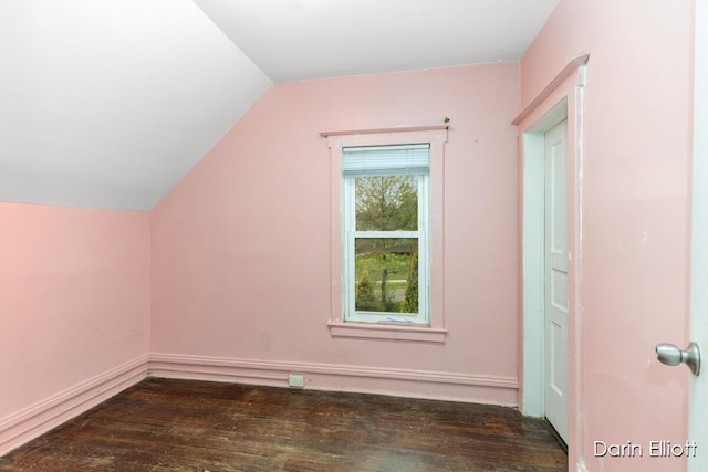 412 Breens Ct SW, Grand Rapids, MI 49503 - bonus room with hardwood / wood-style flooring, vaulted ceiling, and baseboards