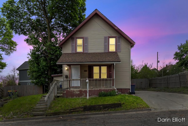 412 Breens Ct SW, Grand Rapids, MI 49503 - traditional-style house with covered porch and fence