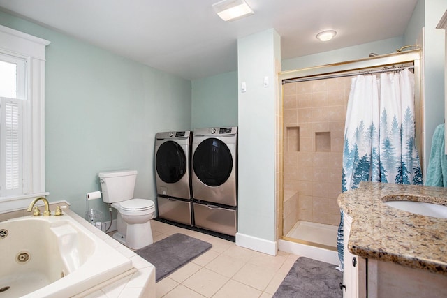 full bath with washer and dryer, a shower stall, tile patterned flooring, a tub with jets, and toilet