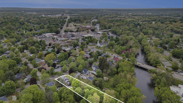 view of property location with property boundaries highlighted, a large body of water, and a forest