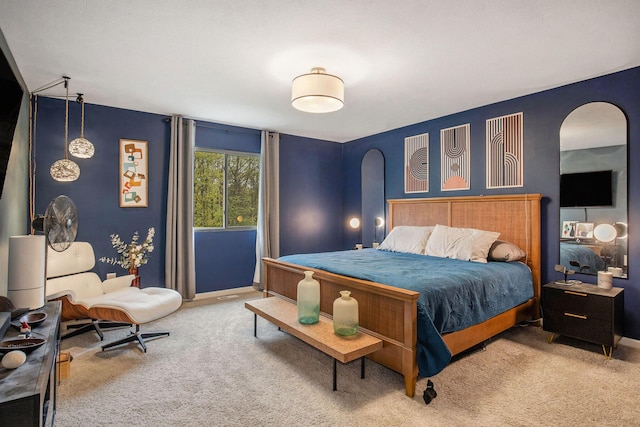 7762 Sierra Dr, Belding, MI 48809 - carpeted bedroom with arched walkways and baseboards