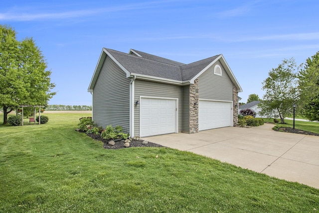 14275 Sunset Ridge Ct, Niles, MI 49120 - view of side of property with driveway, a lawn, a garage, a shingled roof, and stone siding