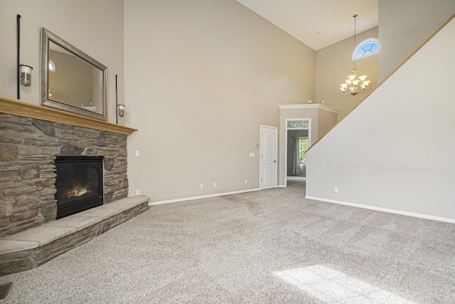 14275 Sunset Ridge Ct, Niles, MI 49120 - unfurnished living room with high vaulted ceiling, baseboards, carpet floors, a fireplace, and a chandelier