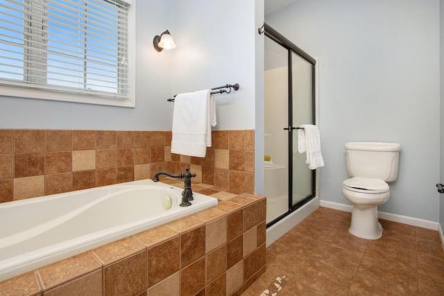 14275 Sunset Ridge Ct, Niles, MI 49120 - full bathroom with a shower stall, toilet, a bath, baseboards, and tile patterned flooring