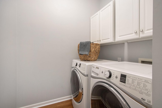 14275 Sunset Ridge Ct, Niles, MI 49120 - laundry room with cabinet space, independent washer and dryer, wood finished floors, and baseboards