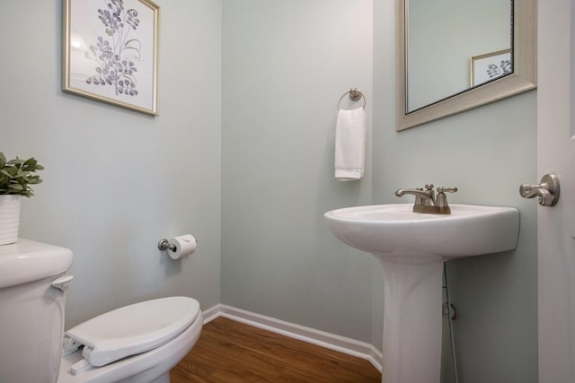 14275 Sunset Ridge Ct, Niles, MI 49120 - half bathroom featuring toilet, wood finished floors, and baseboards