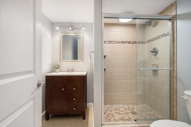 14275 Sunset Ridge Ct, Niles, MI 49120 - full bath with a stall shower, toilet, vanity, tile patterned floors, and baseboards