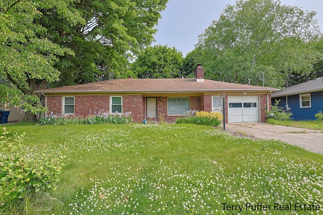 3904 Canterbury Ave, Kalamazoo, MI 49006 - single story home featuring an attached garage, driveway, a chimney, brick siding, and a front lawn