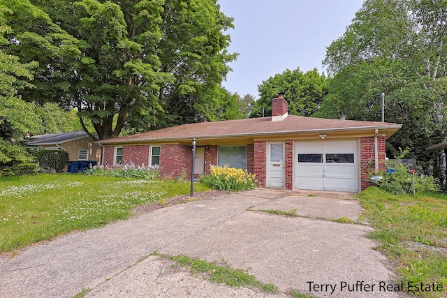 3904 Canterbury Ave, Kalamazoo, MI 49006 - ranch-style home with a chimney, an attached garage, driveway, and brick siding