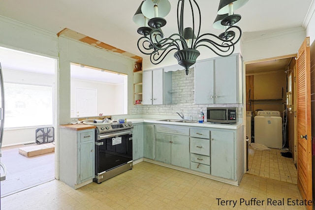 3904 Canterbury Ave, Kalamazoo, MI 49006 - kitchen featuring appliances with stainless steel finishes, a sink, separate washer and dryer, ornamental molding, and green cabinets