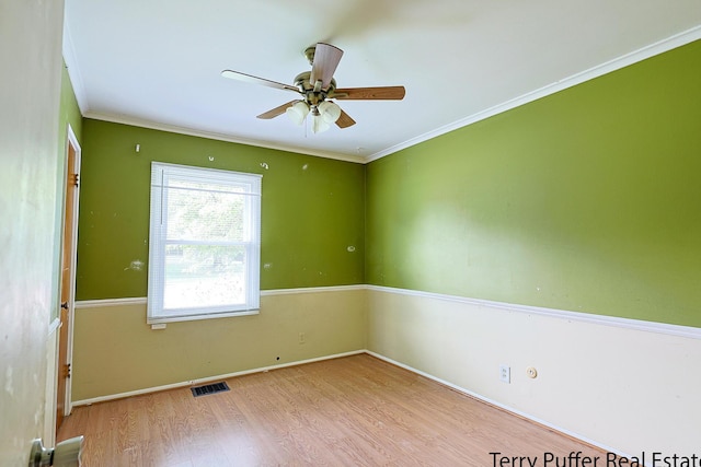 3904 Canterbury Ave, Kalamazoo, MI 49006 - spare room with wood finished floors, ornamental molding, ceiling fan, and baseboards