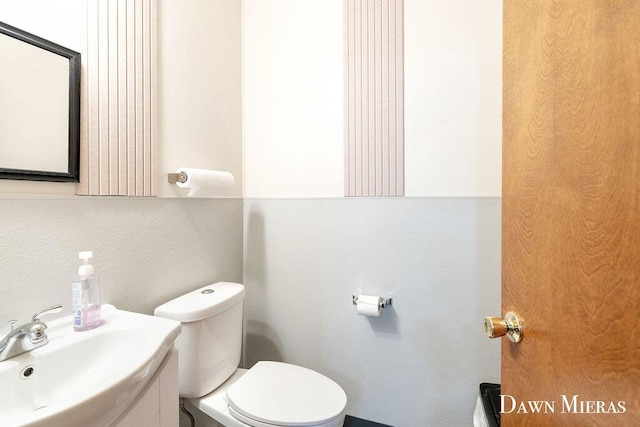 7795 Douglas Ave, Kalamazoo, MI 49009 - bathroom featuring toilet and vanity