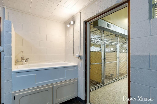 7795 Douglas Ave, Kalamazoo, MI 49009 - bathroom with concrete block wall