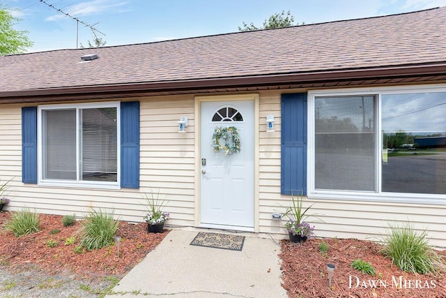 7795 Douglas Ave, Kalamazoo, MI 49009 - doorway to property with roof with shingles