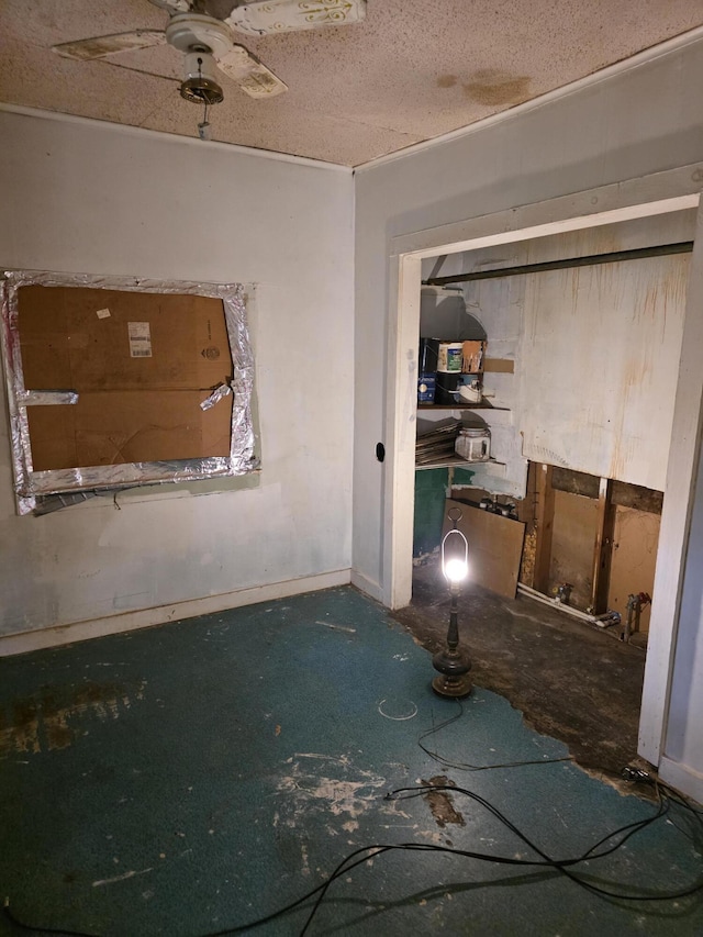 120 2nd St, Ionia, MI 48846 - below grade area featuring baseboards and a ceiling fan