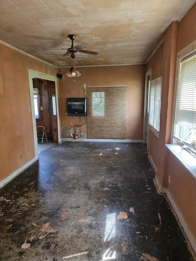 120 2nd St, Ionia, MI 48846 - unfurnished living room with plenty of natural light, ceiling fan, and baseboards