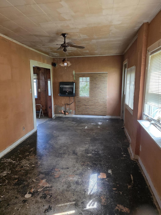 120 2nd St, Ionia, MI 48846 - unfurnished living room featuring ceiling fan, baseboards, and ornamental molding