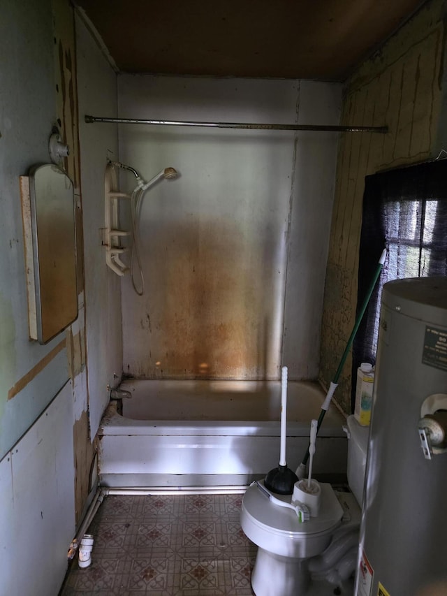 120 2nd St, Ionia, MI 48846 - full bath featuring gas water heater, toilet, bathtub / shower combination, and tile patterned floors