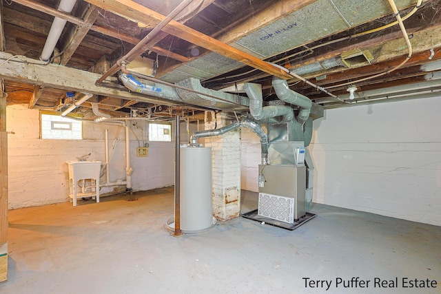 basement featuring water heater, heating unit, and a sink