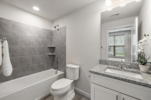 bathroom featuring toilet, vanity, bathing tub / shower combination, baseboards, and tile patterned floors