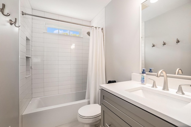 full bathroom with toilet, shower / bathtub combination with curtain, and vanity