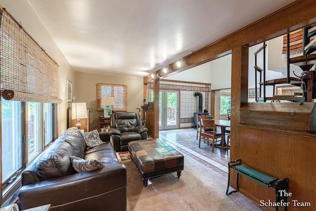 10436 Morgan Mills Ave NE, Greenville, MI 48838 - carpeted living area featuring healthy amount of natural light and tile patterned flooring