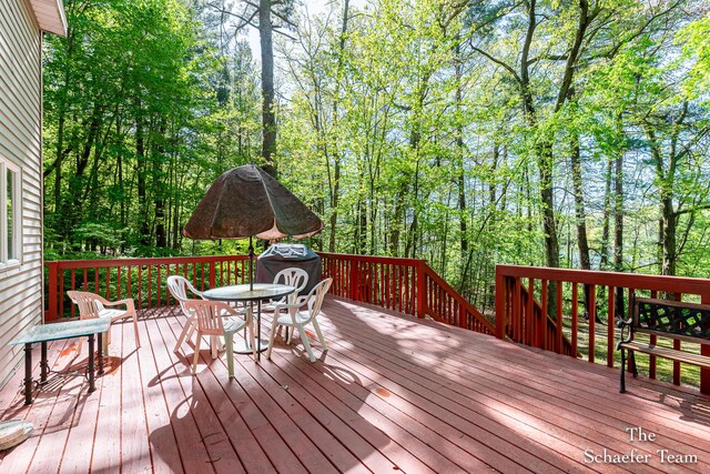 10436 Morgan Mills Ave NE, Greenville, MI 48838 - wooden deck with outdoor dining space