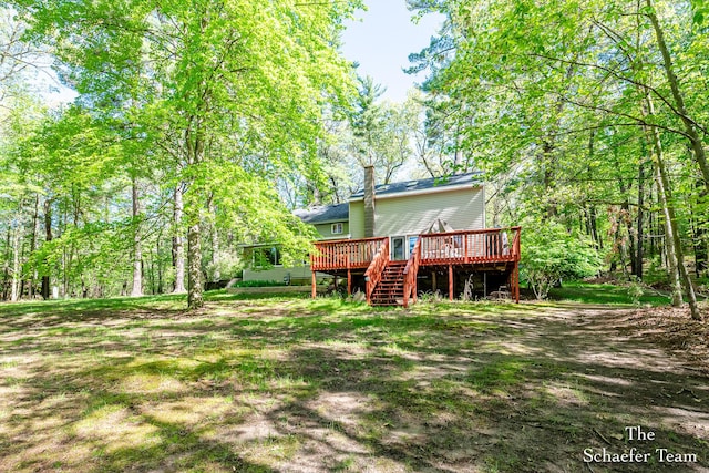 10436 Morgan Mills Ave NE, Greenville, MI 48838 - back of property with a wooden deck and stairway