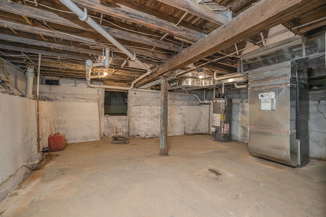 below grade area featuring gas water heater and heating unit