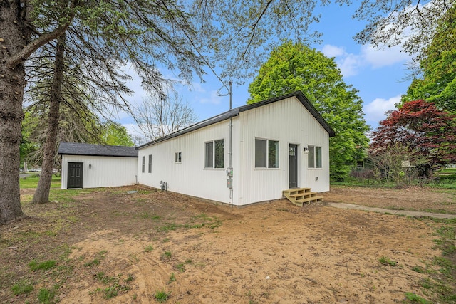 rear view of house with entry steps