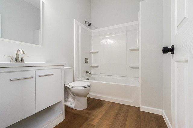 408 W Exchange St, Gobles, MI 49055 - bathroom with wood finished floors, toilet, vanity, and bathtub / shower combination